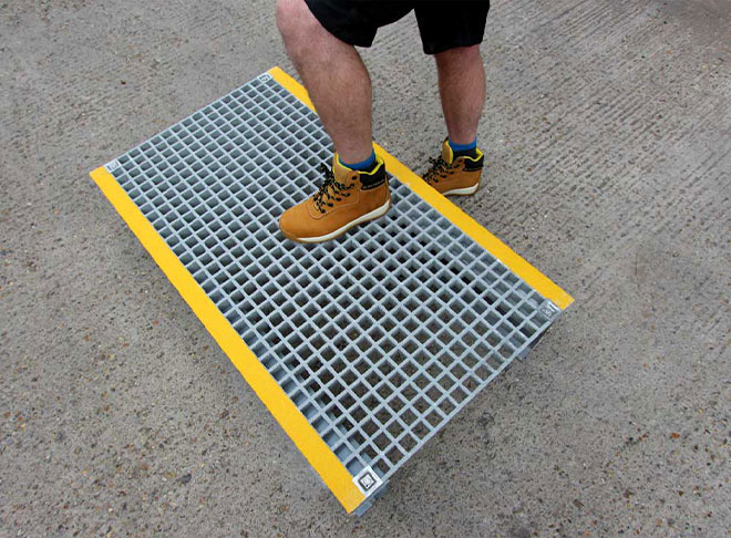 GRP grating platform for pipes, cables and trip hazards.